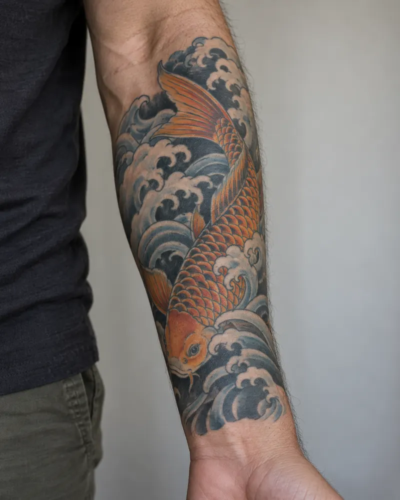 Healed Japanese koi tattoo with waves on a forearm